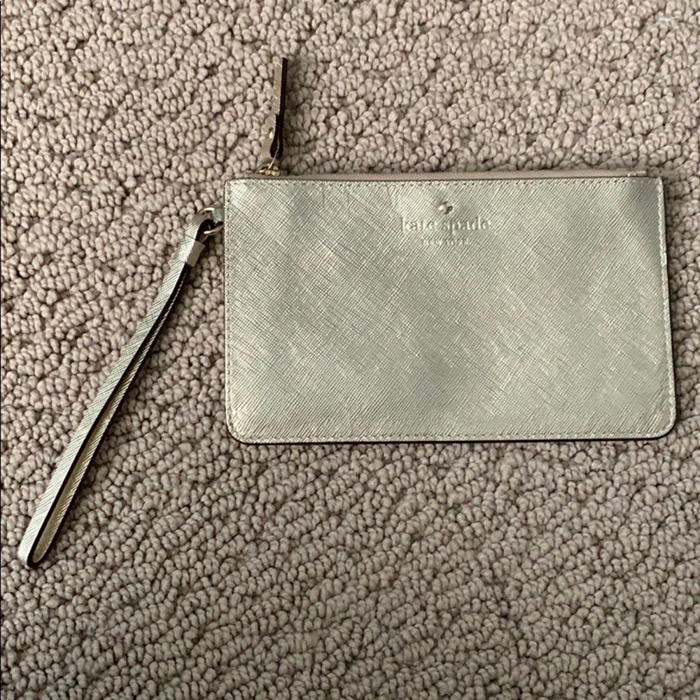 Thin gold Kate Spade wristlet